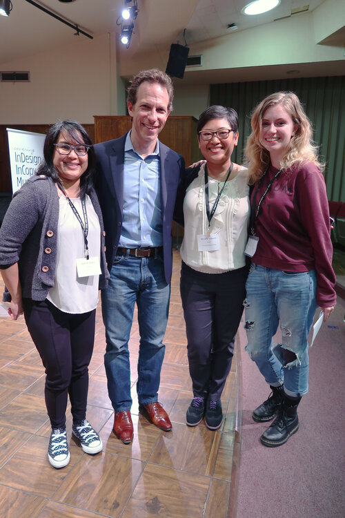 A man and 3 women standing together for a photo